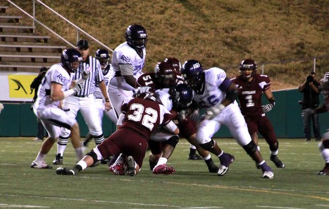 Taking down Abeline Christian player number 6 Saturday night at Kimbrough stadium. Photo by Frankie Sanchez.