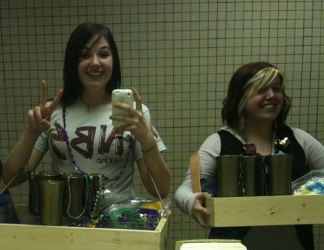NBS Bekah Purl and Chelsea Riddle help at the Mardi Gras event. Photo courtesy of Bekah Purl.