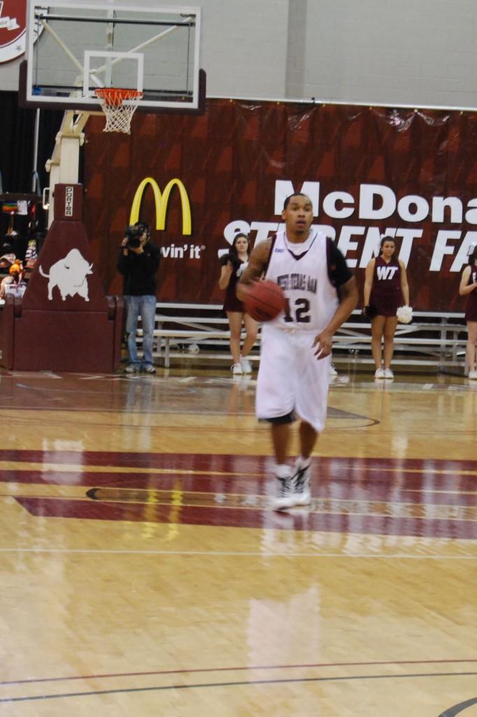 Lionel Foster brings the ball back to WTs zone. Photo by Melissa Bauer-Herzog.