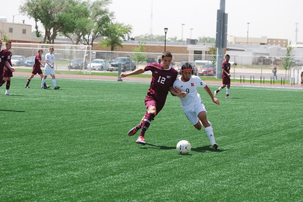 Chris Hutton fights for possession of the ball. Photo by Melissa Bauer-Herzog.