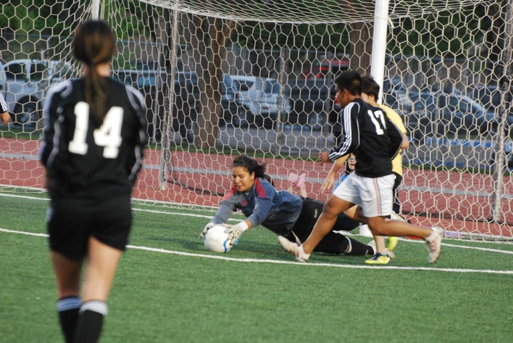 Yvette Bedoy stops the ball by the goal. Photo by Melissa Bauer-Herzog.