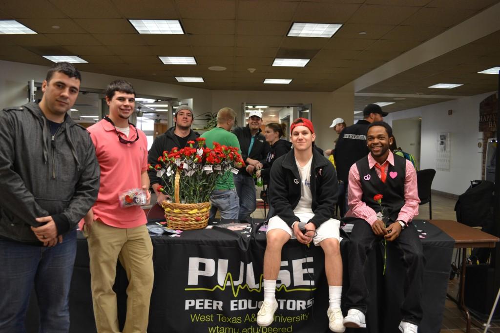 Pulse hands out contraceptives and flowers for Sexual Responsibility week. Photo by Alex Montoya.