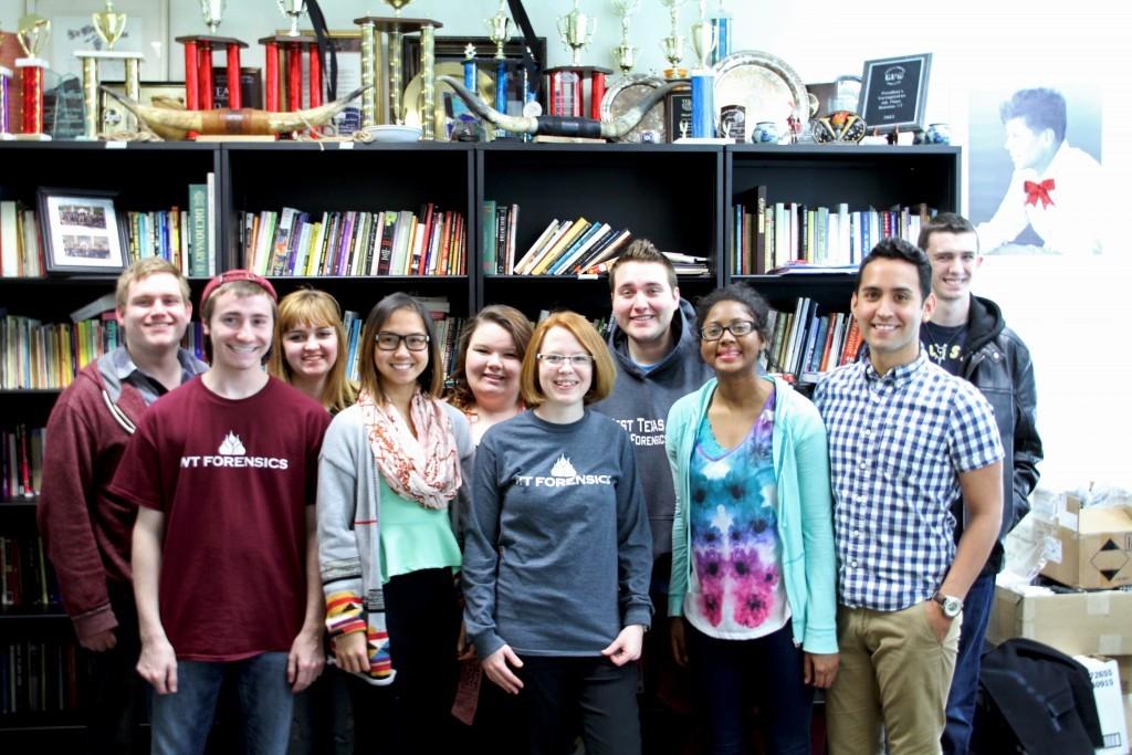 The Forensics Team poses in Connie McKee’s office. The Forensics Team has been competing around the state in preparation for their trip to Barcelona.